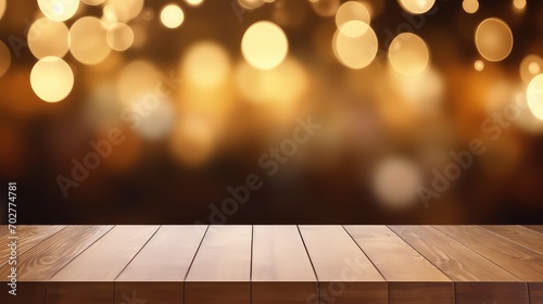 Empty wooden table and bokeh golden lights background.