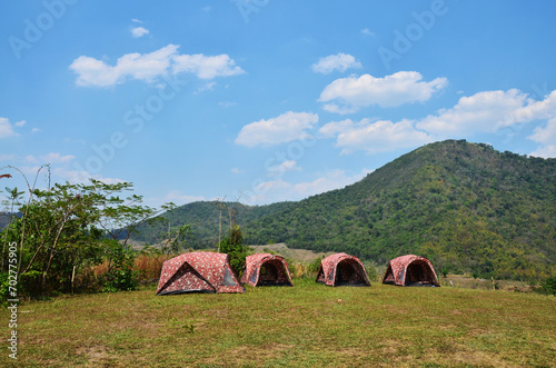 Thai people travelers travel visit and erect pitch tent for sleep rest in camping area Ban Taphoen Khi on Khao Thewada Mountain rest in camping area at Phu Toei National Park in Suphan Buri, Thailand photo