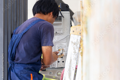 Air conditioning technicians install new air conditioners in homes, Repairman fix air conditioning systems, Air conditioning unit repair and maintenance