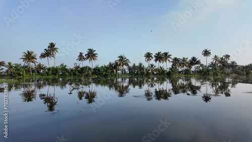 Morning Landscape from Alleppey backwaters with coconut tree and reflection in water,Kerala photo