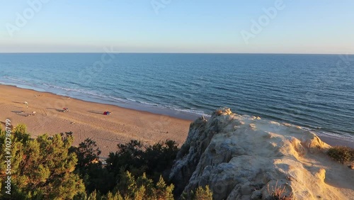 Arenosillo beach, located in Huelva, Spain. Explore the serene beauty of this coastal paradise with its sunlit sandy shores and the rhythmic ebb and flow of the Atlantic Ocean. photo