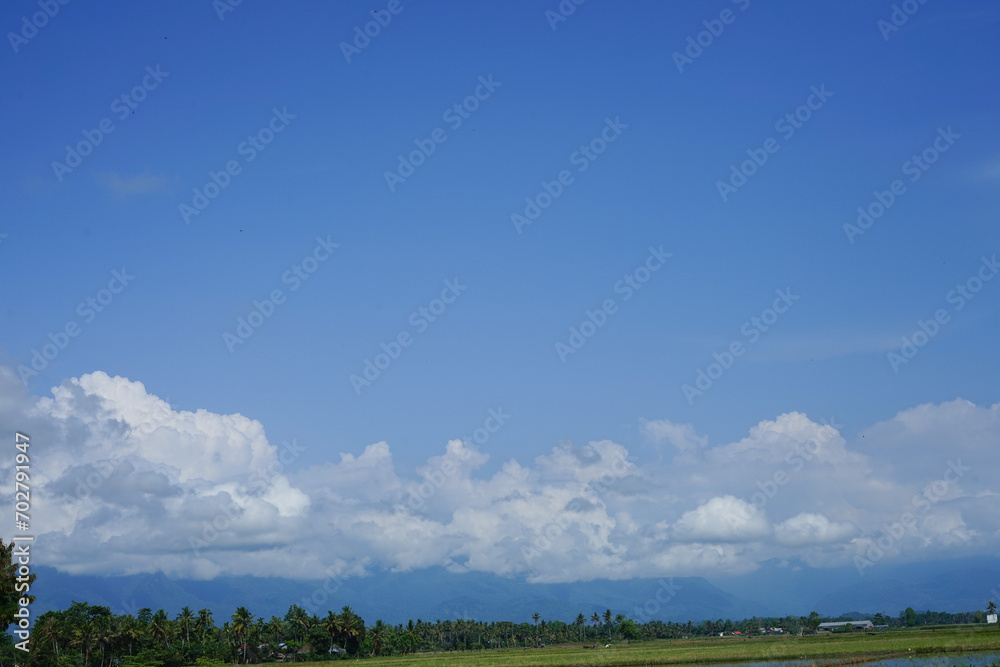 white clouds on a blue sky background white clouds on a blue sky background