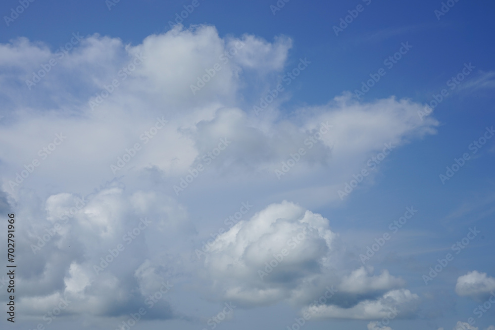 white clouds on a blue sky background white clouds on a blue sky background