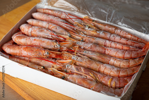 Box with frozen langoustines, shrimp