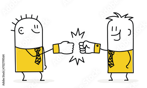 Businessmen making fist bump.
