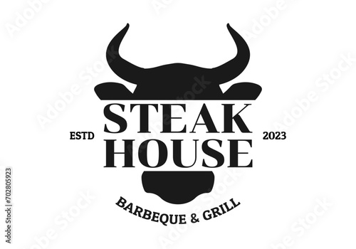 Steak house logo. BBQ, grill, meat restaurant emblem. Steakhouse sign or icon design with bull or cow head. Vector illustration.