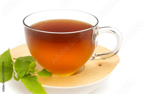 Herbal tea on wooden cup isolated on white background