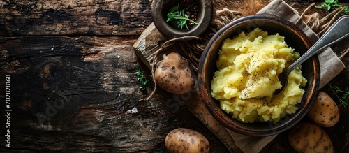 Mashed potato with spoon in serving bowl. with copy space image. Place for adding text or design photo