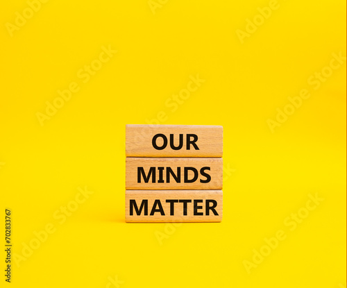 Our Minds Matter symbol. Concept words Our Minds Matter on wooden blocks. Beautiful yellow background. Psychological social and Our Minds Matter concept. Copy space.