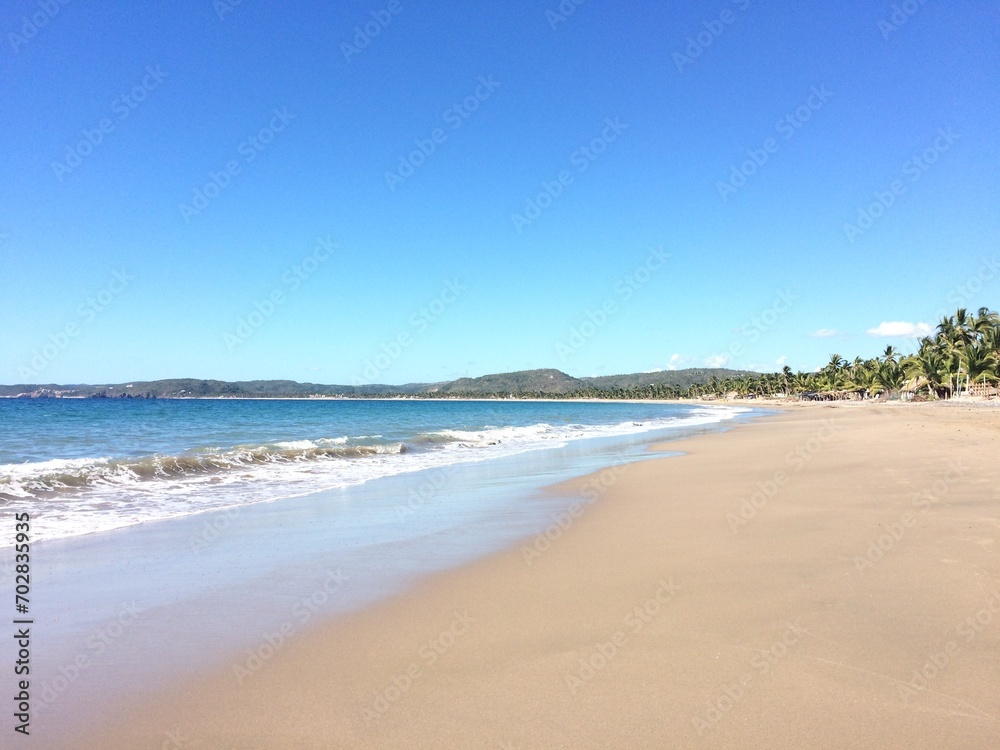 Mexican tropical beach with white sand and palm trees