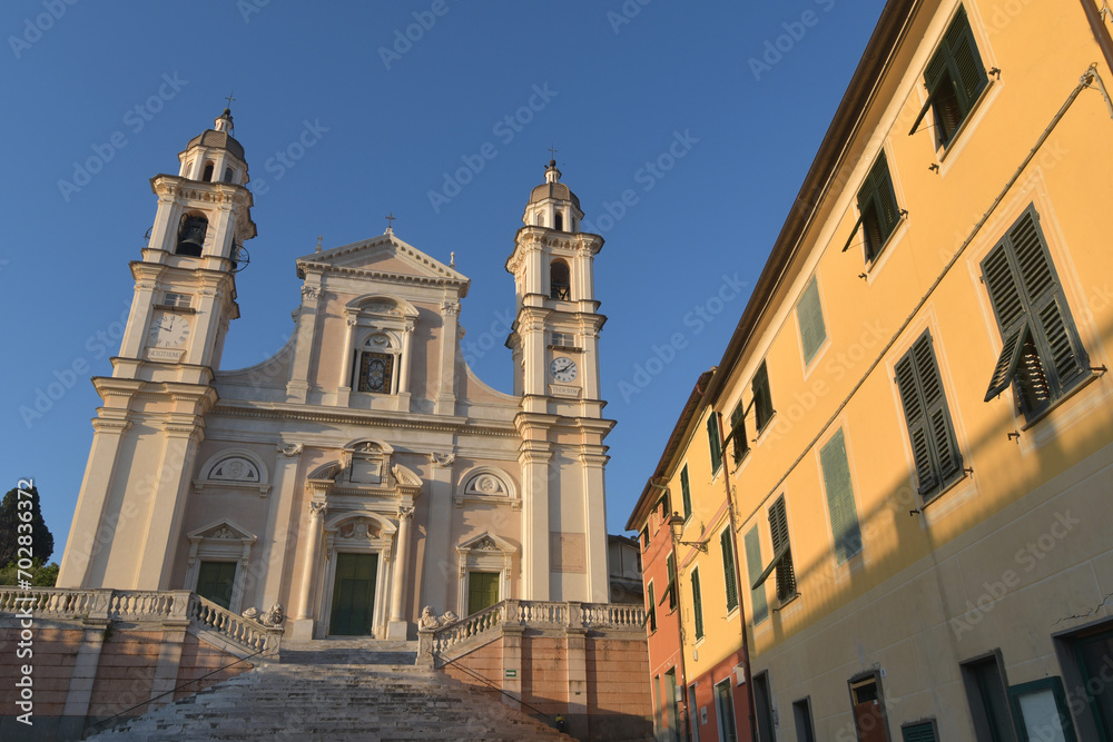 The Basilica of Santo Stefano in Lavagna is a masterpiece of marble, balustrades, stairways, churchyards and lions among the colorful gloomy houses of Piazza Marconi
