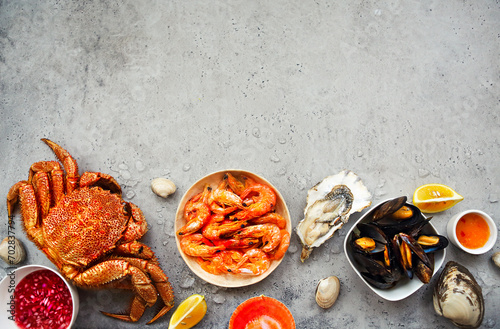 Freshly variety of sea food on the gray kitchen table photo