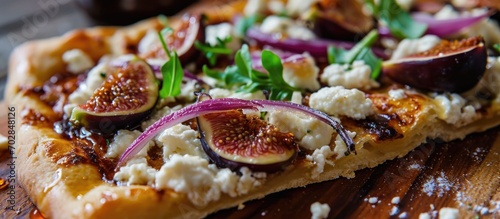 Fig, red onion, goat cheese, and honey added to French Tarte Flambee (Flammkuchen).