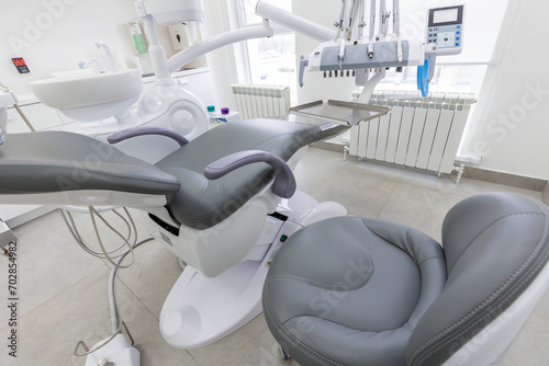 Fototapeta Naklejka Na Ścianę i Meble -  Modern Dental office. equipment at dental office. Dental chair and other accessories. Dental clinic equipment.
