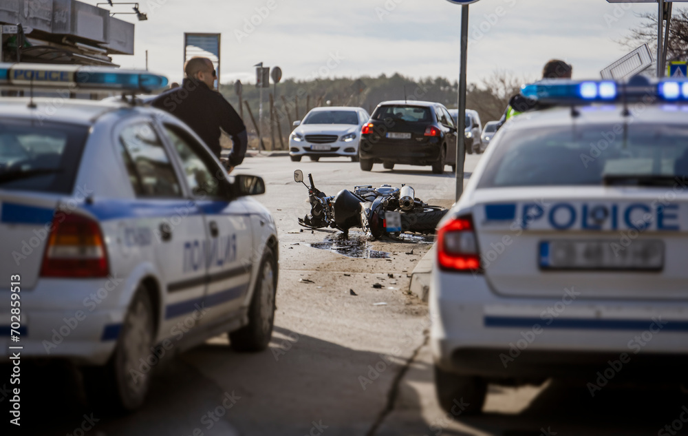 motorcyclist road accident. A motorcycle wrecked in an accident lies on the road motorcyclist road accident. A motorcycle wrecked in an accident lies on the road