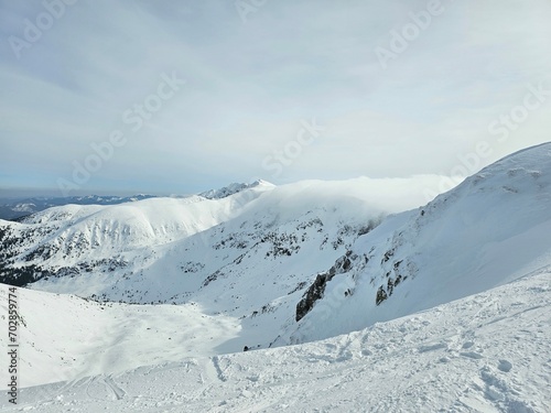 Snowy Chopok mountaintop panorama view on a cloudy winter day, Slovakia