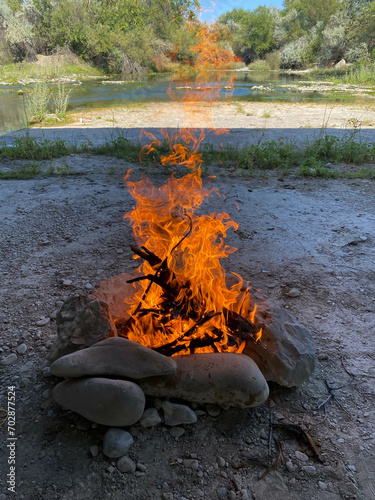 campfire in nature near the river outdoor recreation 
