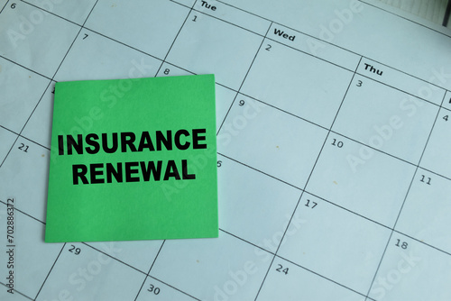 Print op canvas Concept of Insurance Renewal write on sticky notes isolated on Wooden Table