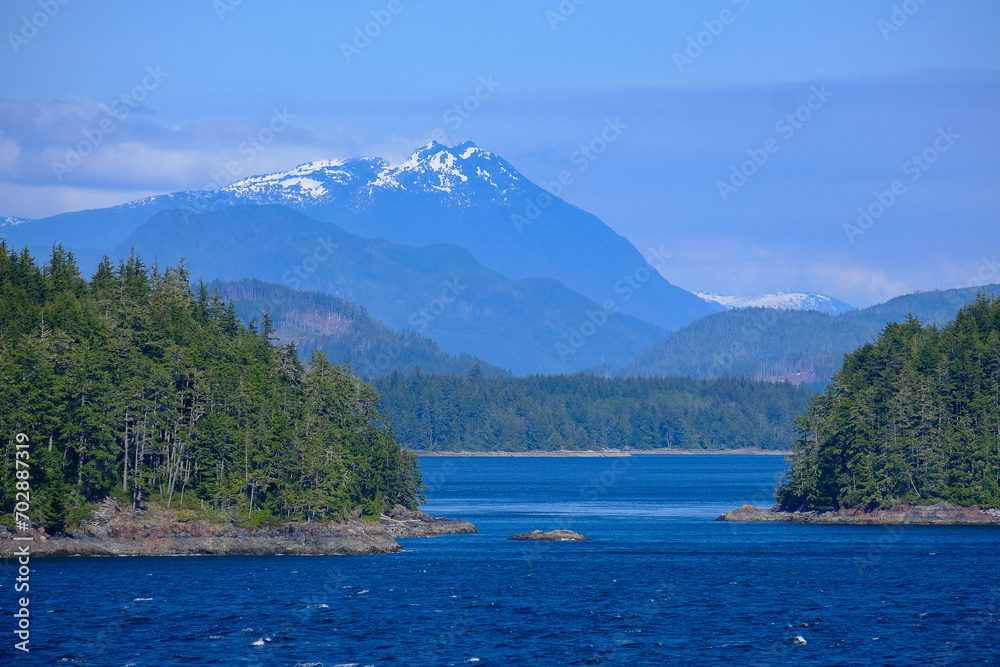Panoramic morning or day time landscape nature coastal scenery with beautiful blue sky and dramatic cloudscapes in Alaska Inside Passage glacier mountain range view