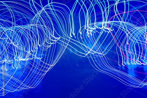 Drawing with light in the dark. Abstract background. Long exposure