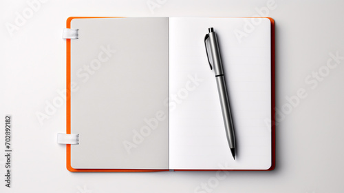 notebook calendar with a pen placed on it 