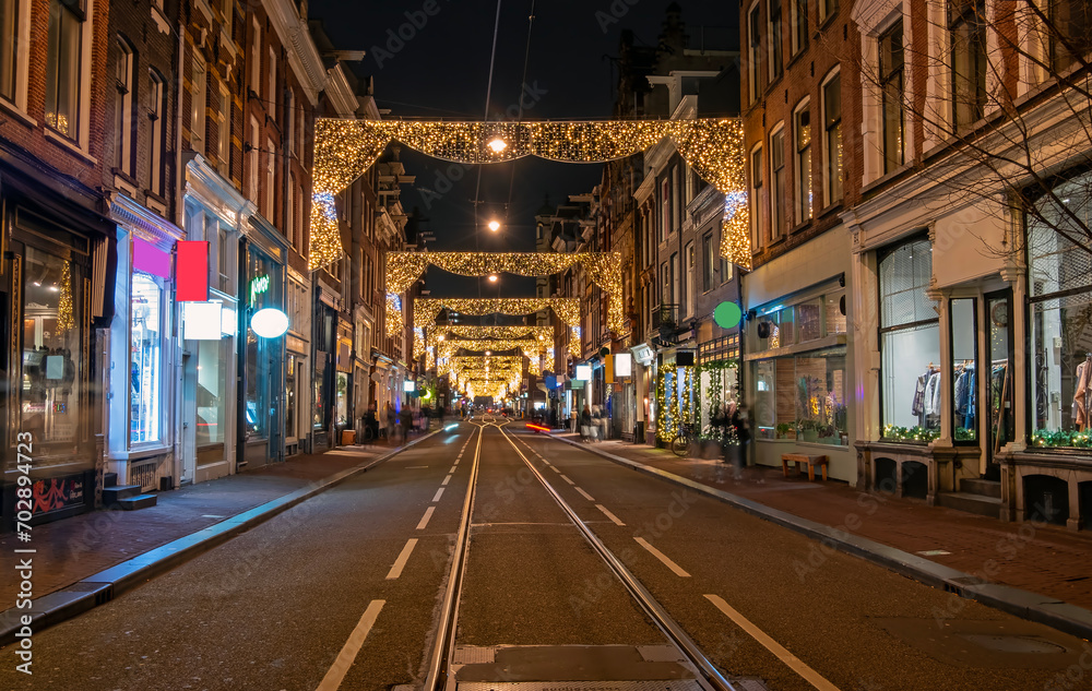 Decorated street in Amsterdam at christmas time in the Netherlands by night