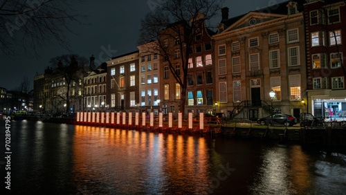 Amsterdam, the Netherlands - December 18, 2023: In December and January, the city-center lights up during free Amsterdam Light Festival. © Nataraj