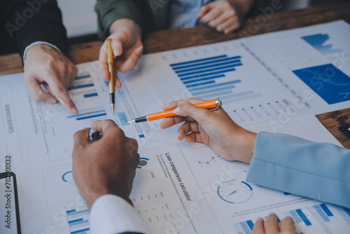 Co working conference, Business team meeting present, investor colleagues discussing new plan financial graph data on office table with laptop and digital tablet, Finance, accounting, investment. photo