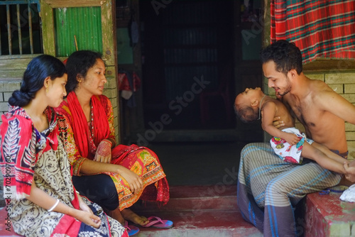 Bangladeshi rural family members are having fun together  © Susmit