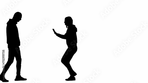 Black silhouettes of thief and victim on white isolated background. Girl stepping back, man robber walking threatening her, catches begins to strangle girl. photo