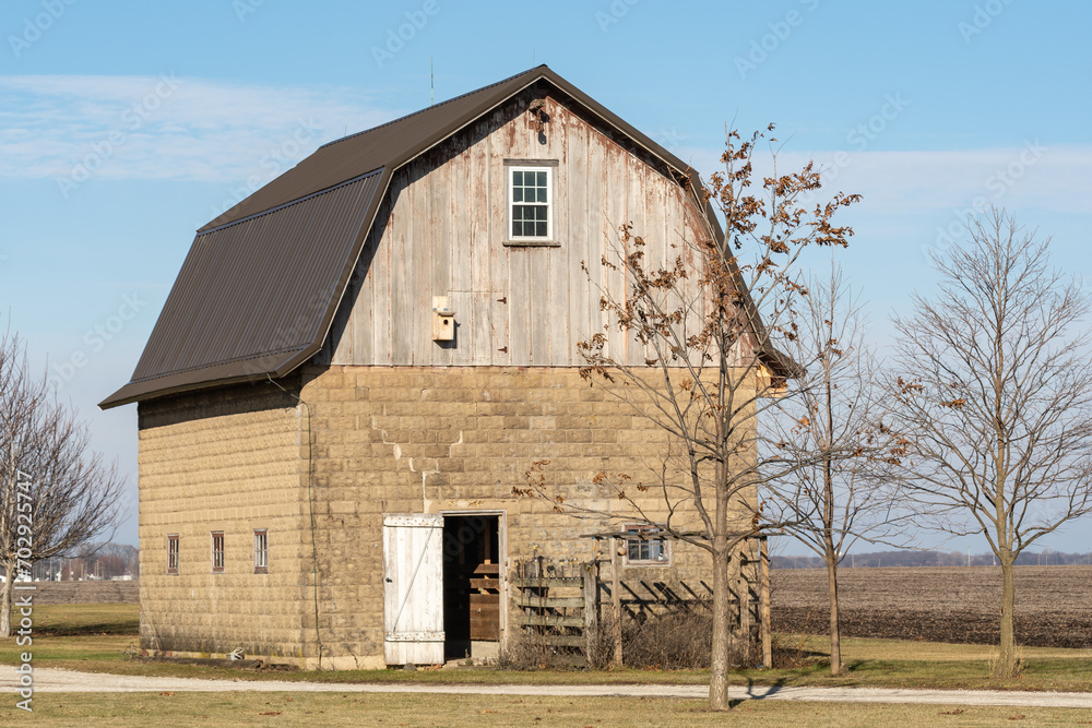 Old weathered wooden barn in rural Livingston county, Illinois, USA. Old weathered wooden barn in rural Livingston county, Illinois, USA.