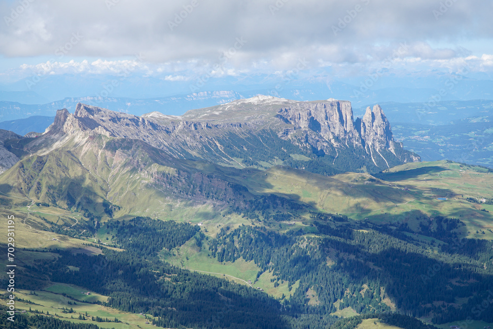 Amazing dolomite panoramic view of Alpe di Siusi, Puez Odles Naturepark upto Sassolungo mountain range in South Tyrol, Italy. Amazing dolomite panoramic view of Alpe di Siusi, Puez Odles Naturepark upto Sassolungo mountain range in South Tyrol, Italy.