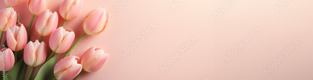 Pink tulip flowers on pastel peach background. Image for a wedding, women's day or mother's day themed greeting card or invitation. Banner with space for text - obrazy, fototapety, plakaty 