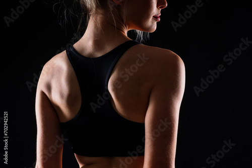 Young strong sporty athletic fitness trainer instructor woman. Workout sport concept