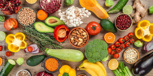 Fototapeta Naklejka Na Ścianę i Meble -  Fresh vegetables, fruits and seeds on table, vegan food cooking ingredients. Concept of balanced healthy diet
