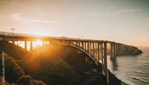 view of bixby creek bridge at sunset photo