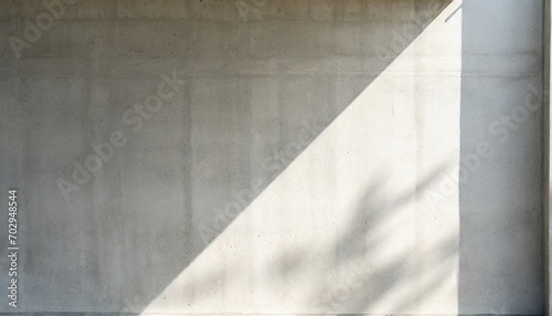 abstract empty modern concrete wall with recess outside with daylight sun shadow and copy space industrial background template