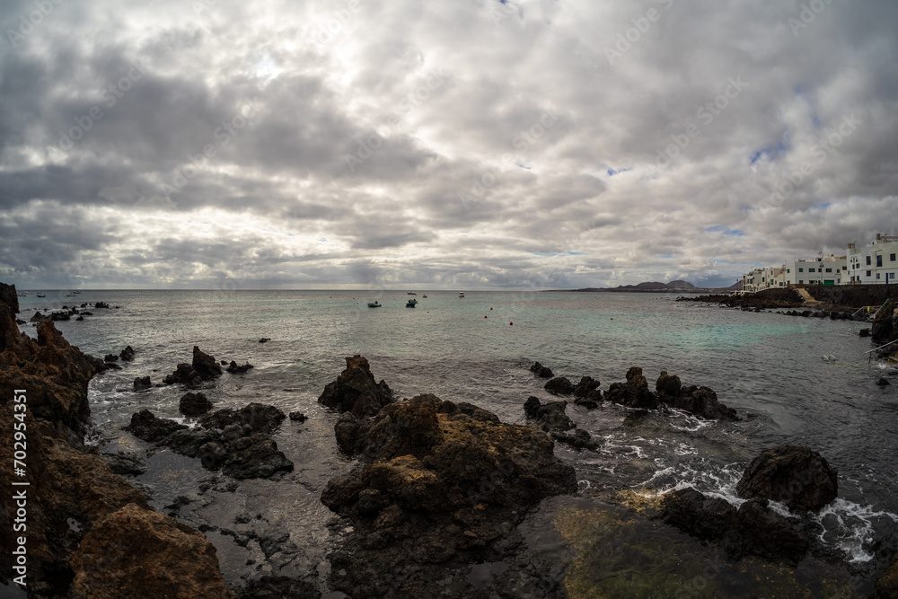 Rocky shore of Punta Mujeres bay. Lanzarote, Canary Islands. Spain.
