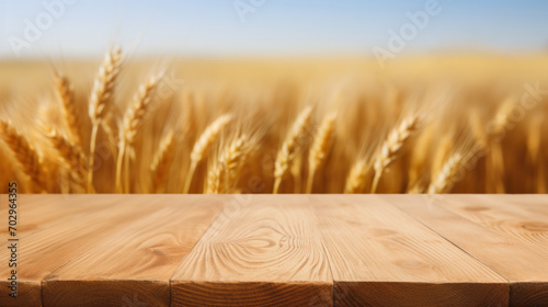 empty wooden countertop in front of a wheat field, a place to present a product layout photo