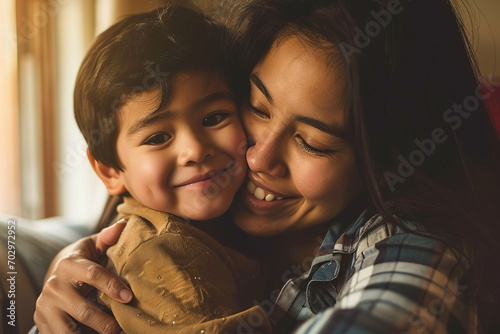 Affectionate moment between smiling asian mother and son at home, showcasing a warm, loving family dynamic