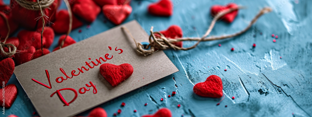 red hearts on a blue background for Valentine's Day and the inscription Valentine's Day. red hearts on a blue background for Valentine's Day and the inscription Valentine's Day.
