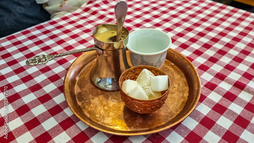 Bosnian Coffee Pot, also known as Dzezva. A Dzezva, or cezve is a pot designed specifically to make Turkish or Bosnian coffee. Served in traditional restaurant in Maribor, Slovenia photo