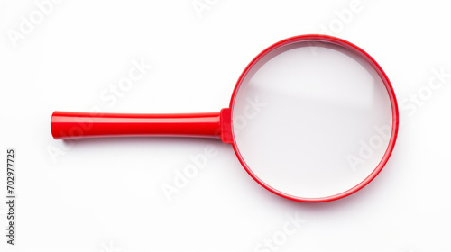 Plastic red magnifying glass isolated on white background