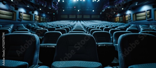 Empty-seated movie theater with high contrast image projection. © TheWaterMeloonProjec