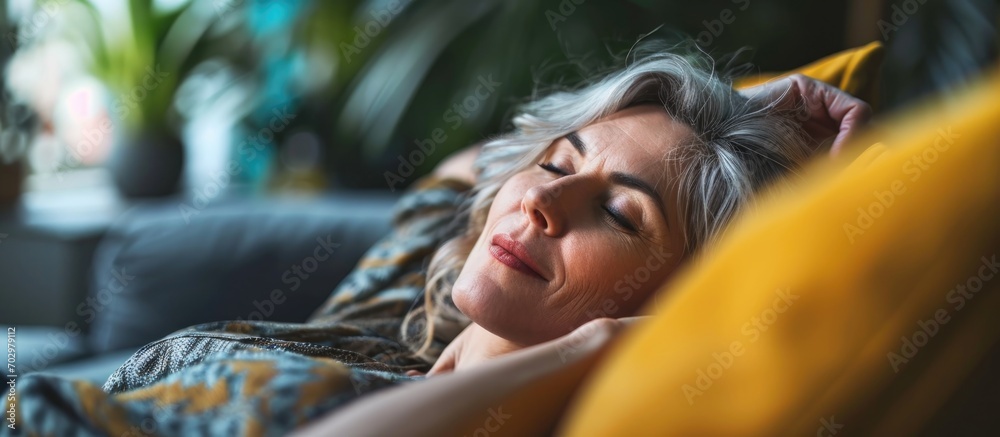 Maximizing her leisure time. Close-up photo of an appealing lady unwinding on her couch. Maximizing her leisure time. Close-up photo of an appealing lady unwinding on her couch.
