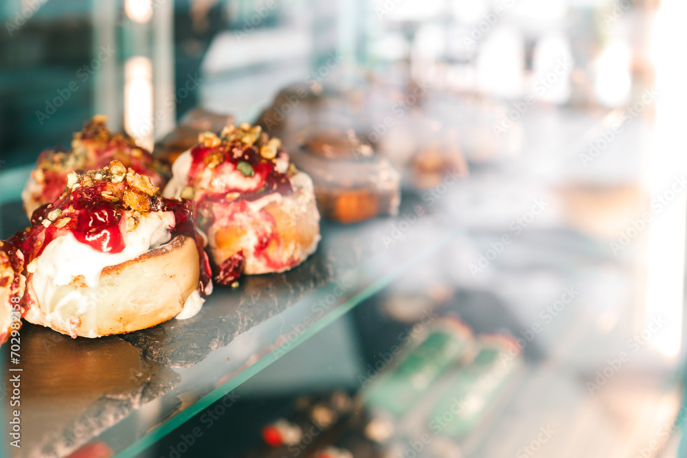 Freshly baked Cinnabons on display in a cafe Freshly baked Cinnabons on display in a cafe