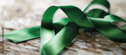 February awareness for gallbladder and bile duct cancer, represented by a green ribbon. photo