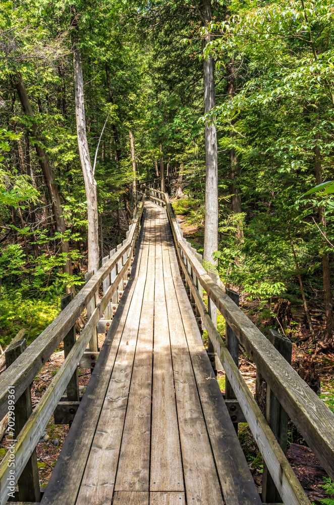 Crawford Lake Conservation area, wood pathway around the lake shore, Milton, ON, Canada Crawford Lake Conservation area, wood pathway around the lake shore, Milton, ON, Canada