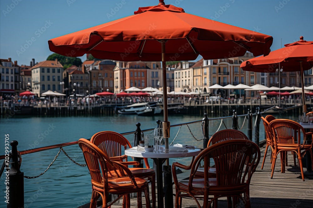 Fototapeta premium Sun kissed coastal promenade vibrant outdoor dining and leisurely activities in a charming setting