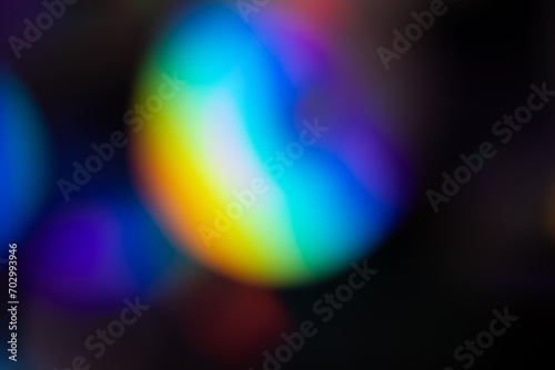 Multi-colored lens flare bokeh. A rainbow flare is similar to the flare on a photographic film. Abstract Bright Overlay Element